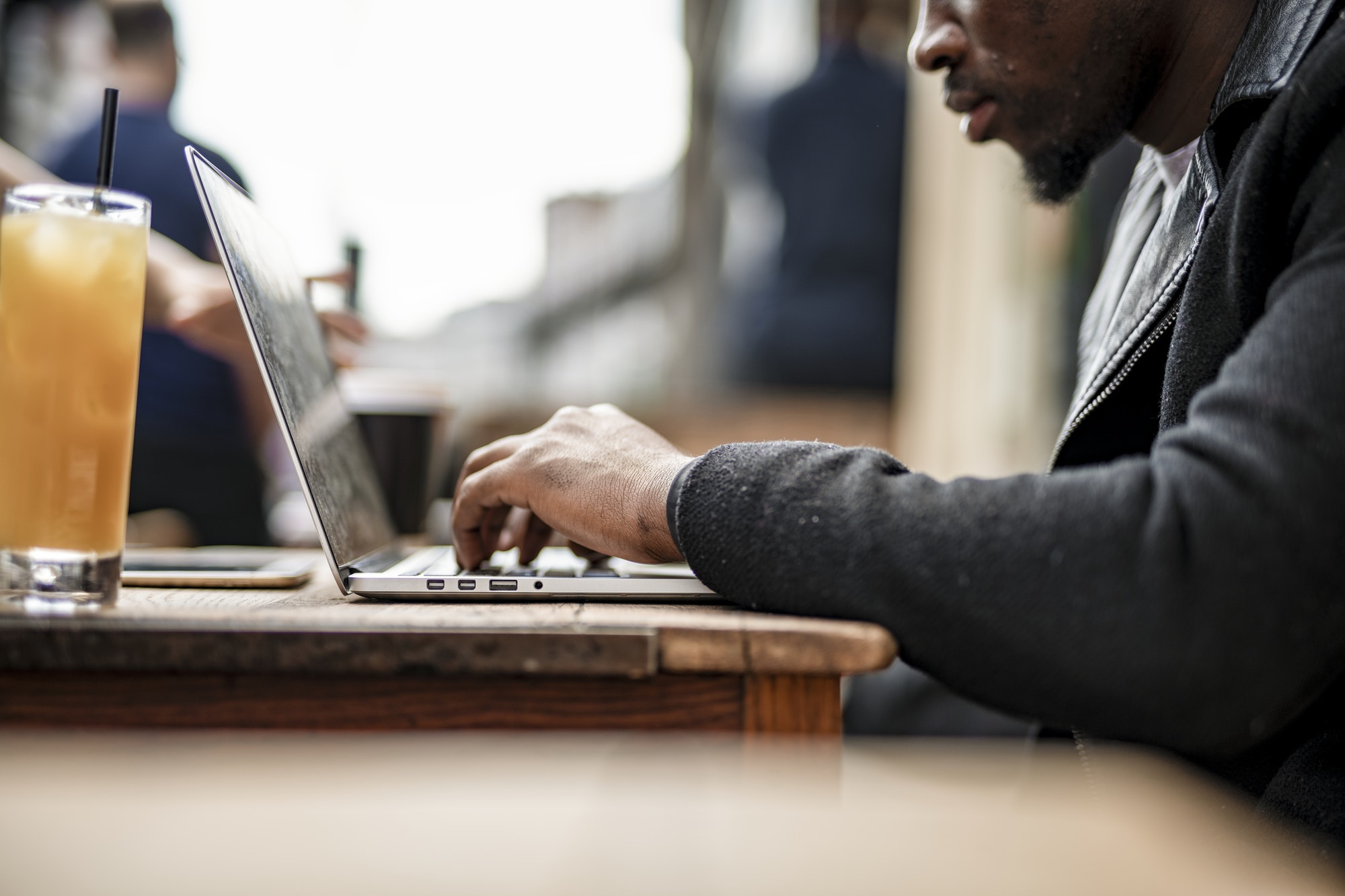 Businessman working remotely from a cafe